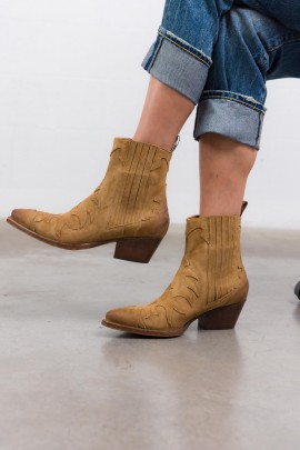 Camel suede cowboy boots with distressed soles